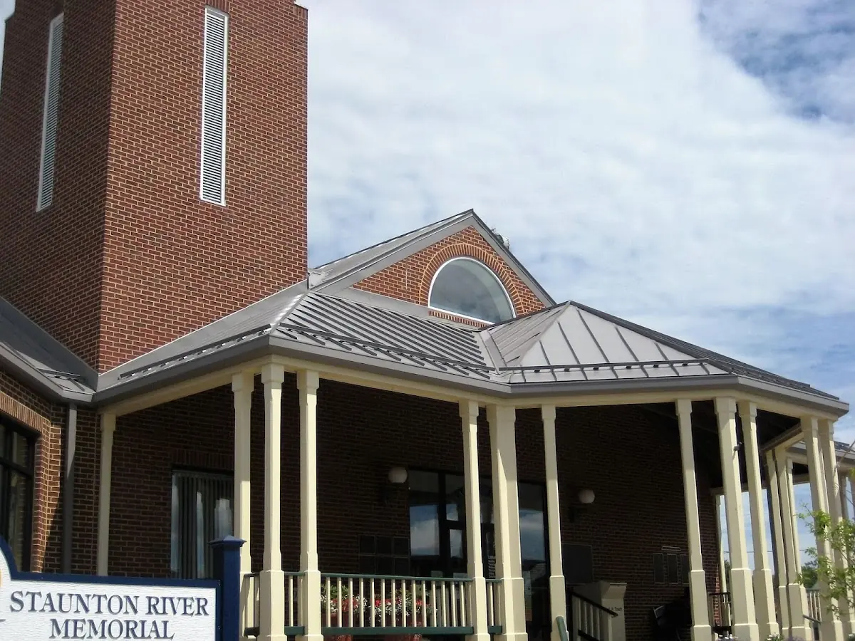 Skilled roofing craftsmen working on a residential roof in Daleville